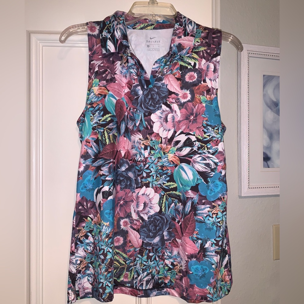 Multicolored floral sleeveless Nike Golf shirt. Size: women’s small